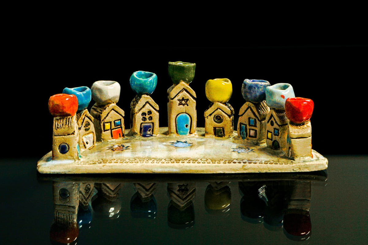Colourful handmade ceramic village menorah